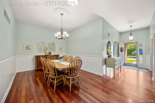 52221 Giuliano Ln, Macomb, MI 48042 - dining area featuring wood finished floors and a chandelier