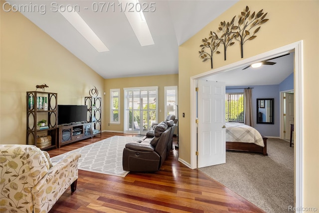 52221 Giuliano Ln, Macomb, MI 48042 - living area featuring a skylight, healthy amount of natural light, high vaulted ceiling, and wood finished floors