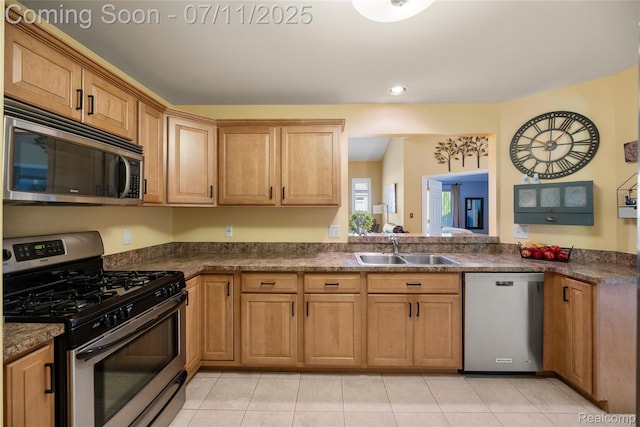 52221 Giuliano Ln, Macomb, MI 48042 - kitchen with appliances with stainless steel finishes, dark countertops, light tile patterned flooring, and recessed lighting