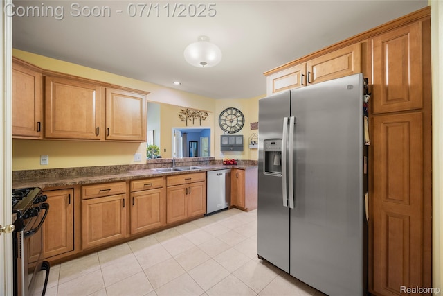 52221 Giuliano Ln, Macomb, MI 48042 - kitchen featuring appliances with stainless steel finishes, dark countertops, and light tile patterned floors