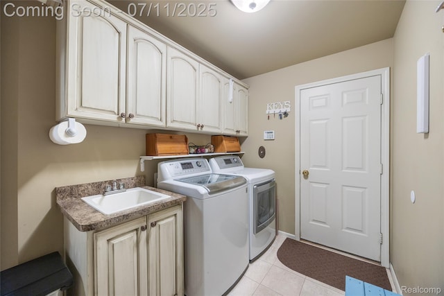 52221 Giuliano Ln, Macomb, MI 48042 - laundry area with washer and dryer, cabinet space, and light tile patterned flooring