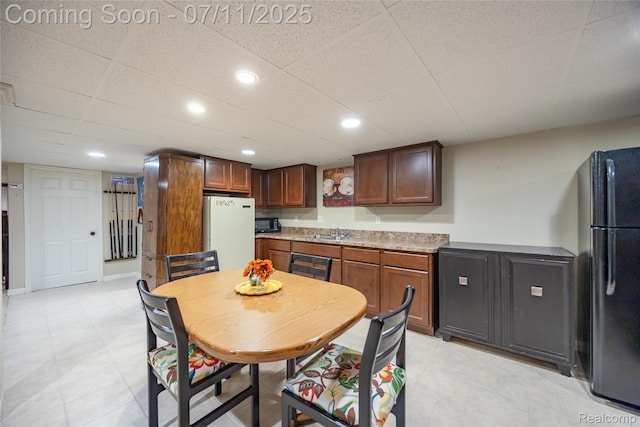 52221 Giuliano Ln, Macomb, MI 48042 - kitchen with black appliances, light countertops, and recessed lighting