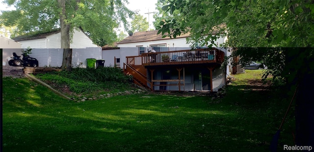 507 Main St, Fenton, MI 48430 - back of property featuring stairway, a deck, and a yard