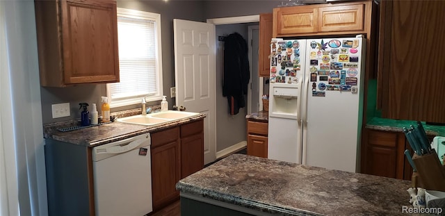 507 Main St, Fenton, MI 48430 - kitchen with white appliances and dark stone counters