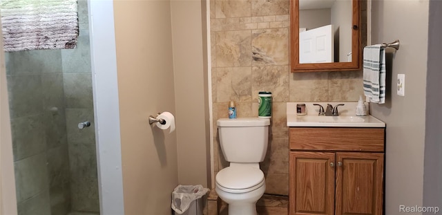 507 Main St, Fenton, MI 48430 - bathroom featuring tile walls, vanity, and tiled shower