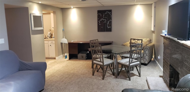 507 Main St, Fenton, MI 48430 - carpeted dining area featuring a paneled ceiling and a fireplace