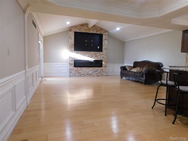2238 Nadine Dr, Sterling Heights, MI 48310 - living area featuring a decorative wall, a fireplace, light wood finished floors, and a wainscoted wall