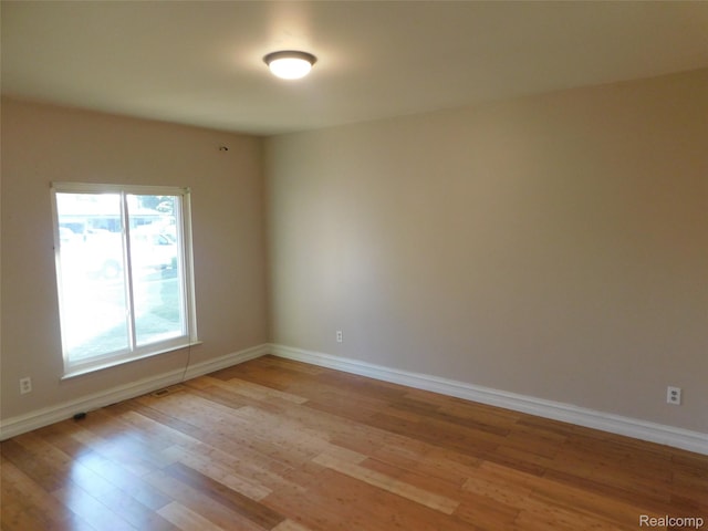 2238 Nadine Dr, Sterling Heights, MI 48310 - spare room featuring light wood-type flooring and baseboards