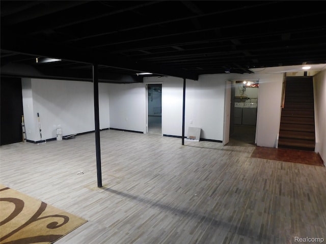 2238 Nadine Dr, Sterling Heights, MI 48310 - finished basement with stairs, washer and dryer, and wood finished floors
