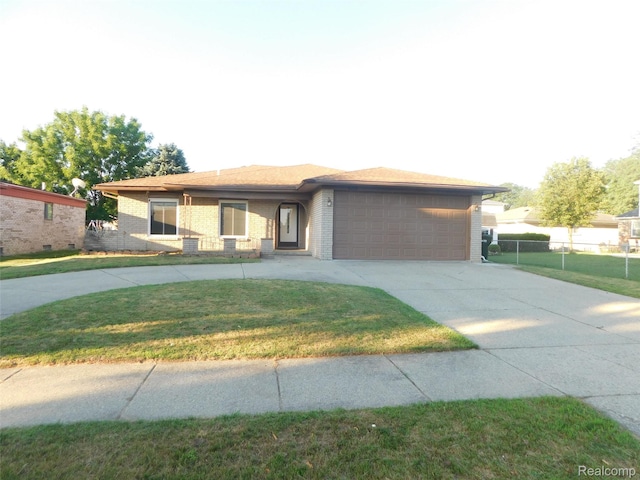 2238 Nadine Dr, Sterling Heights, MI 48310 - view of front of property featuring concrete driveway, a garage, and brick siding