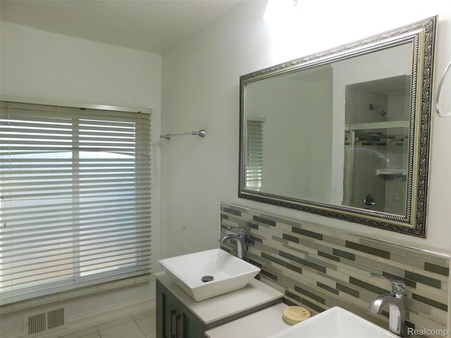 2238 Nadine Dr, Sterling Heights, MI 48310 - full bath with backsplash, a shower with shower door, vanity, and tile patterned flooring