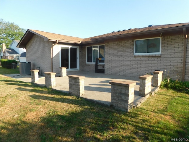 2238 Nadine Dr, Sterling Heights, MI 48310 - rear view of property featuring a patio area, brick siding, and a yard