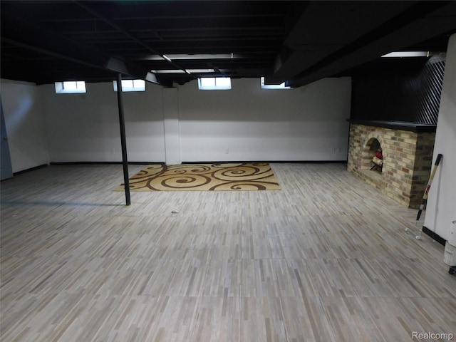 2238 Nadine Dr, Sterling Heights, MI 48310 - below grade area with wood finished floors and baseboards