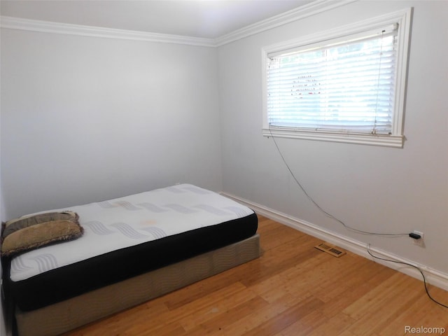 2238 Nadine Dr, Sterling Heights, MI 48310 - bedroom featuring light wood-style floors and crown molding