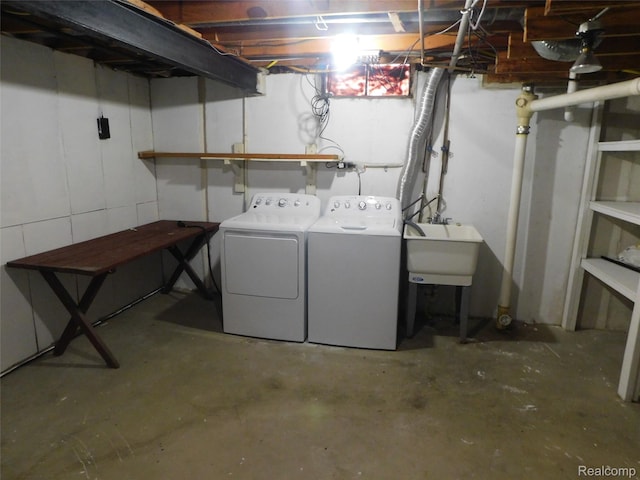 2238 Nadine Dr, Sterling Heights, MI 48310 - unfinished below grade area with separate washer and dryer and a sink