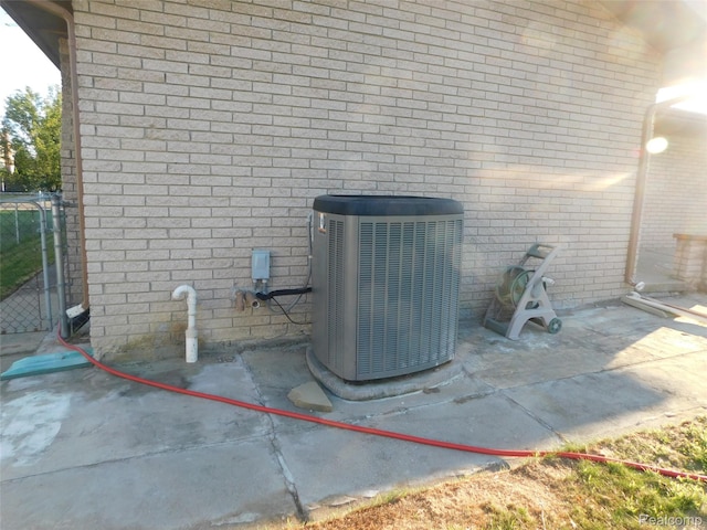 2238 Nadine Dr, Sterling Heights, MI 48310 - exterior view of a central AC unit and brick siding