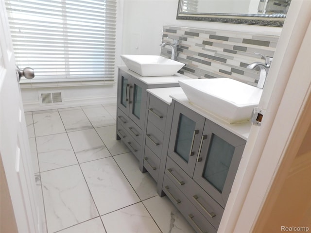 2238 Nadine Dr, Sterling Heights, MI 48310 - bathroom with marble look tiles and vanity