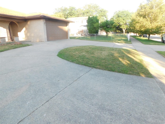 2238 Nadine Dr, Sterling Heights, MI 48310 - view of property exterior with driveway and brick siding