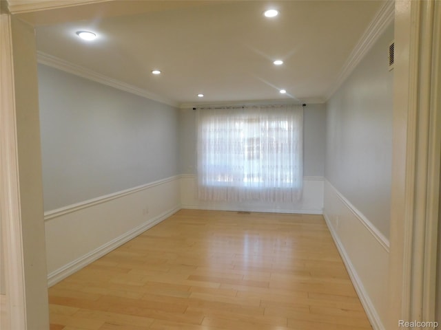 2238 Nadine Dr, Sterling Heights, MI 48310 - empty room featuring ornamental molding, light wood-style flooring, recessed lighting, and a wainscoted wall