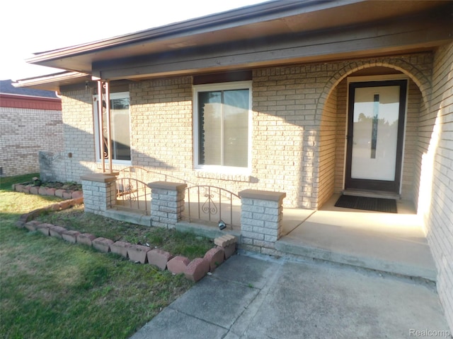 2238 Nadine Dr, Sterling Heights, MI 48310 - doorway to property with brick siding and a porch