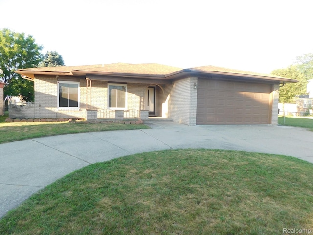 2238 Nadine Dr, Sterling Heights, MI 48310 - view of front facade featuring driveway, brick siding, a garage, and a front lawn