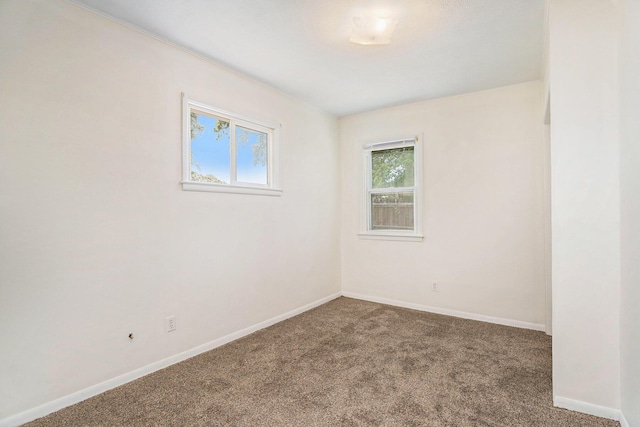 340 Nora St SE, Grand Rapids, MI 49548 - unfurnished room featuring carpet floors and baseboards