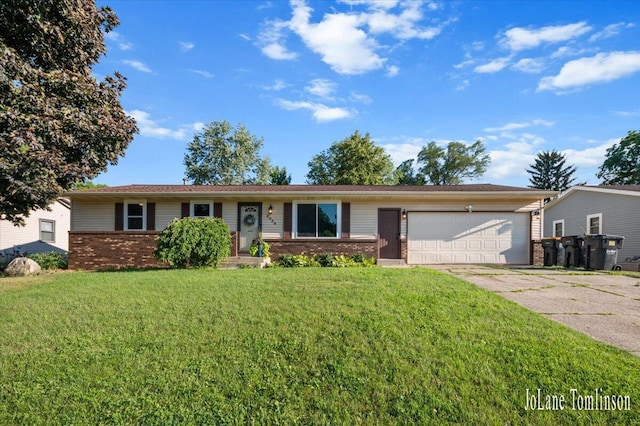 2958 Bluewater Ln SW, Grandville, MI 49418 - ranch-style home featuring brick siding, an attached garage, driveway, and a front lawn