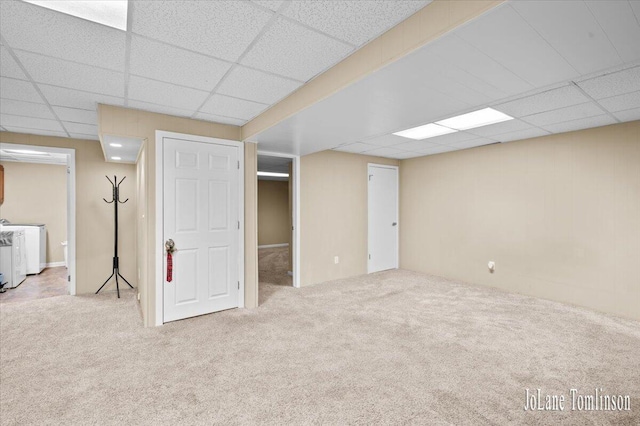 2958 Bluewater Ln SW, Grandville, MI 49418 - finished below grade area with a paneled ceiling, carpet, and washer and clothes dryer