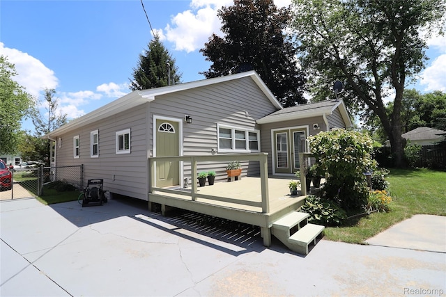 6500 Cooper St, Taylor, MI 48180 - back of house featuring a wooden deck, a gate, and a patio area