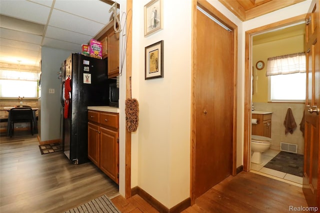 6500 Cooper St, Taylor, MI 48180 - hallway with wood finished floors, healthy amount of natural light, and a paneled ceiling