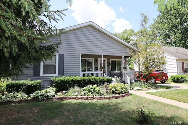 6500 Cooper St, Taylor, MI 48180 - bungalow featuring a porch and a front lawn