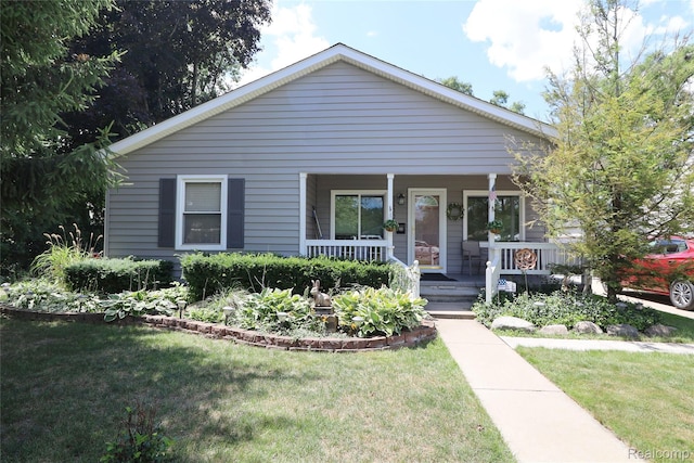 6500 Cooper St, Taylor, MI 48180 - bungalow-style house featuring covered porch and a front yard