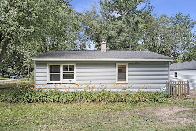 165 Kenton St SE, Grand Rapids, MI 49548 - view of side of property featuring a chimney