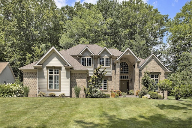 106 Kingsbury Ct, Battle Creek, MI 49015 - view of front facade with brick siding and a front lawn