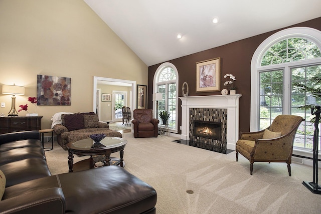 106 Kingsbury Ct, Battle Creek, MI 49015 - carpeted living room with high vaulted ceiling, a fireplace with flush hearth, and recessed lighting