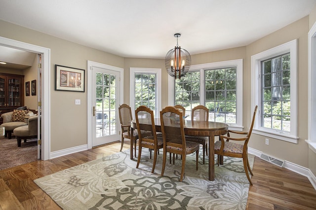 106 Kingsbury Ct, Battle Creek, MI 49015 - dining room with a chandelier and wood finished floors