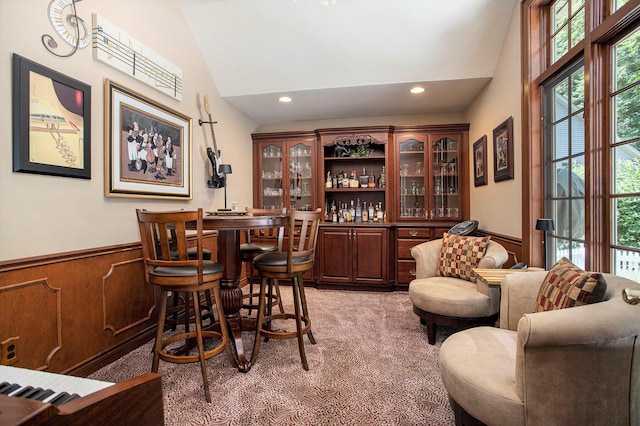 106 Kingsbury Ct, Battle Creek, MI 49015 - indoor dry bar featuring a wainscoted wall, recessed lighting, high vaulted ceiling, and light carpet