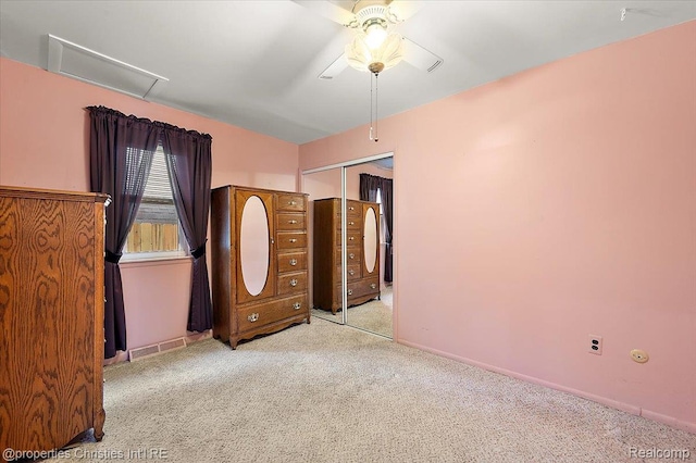 4681 Cass Elizabeth Rd, Waterford, MI 48327 - unfurnished bedroom featuring carpet floors, a closet, ceiling fan, and attic access
