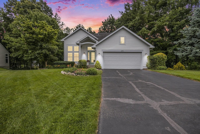 270 Silver Ridge Dr, Holland, MI 49424 - view of front of property featuring asphalt driveway, a front lawn, and a garage