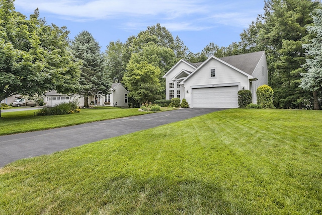 270 Silver Ridge Dr, Holland, MI 49424 - view of front facade with asphalt driveway, a front yard, and a garage