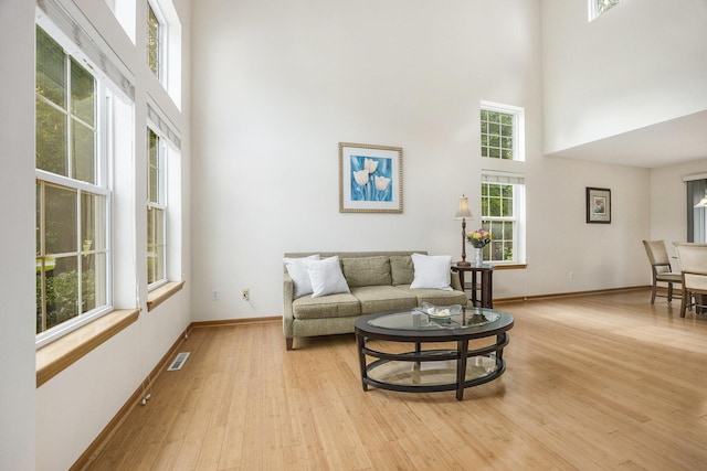 270 Silver Ridge Dr, Holland, MI 49424 - living room featuring a towering ceiling and light wood-style flooring