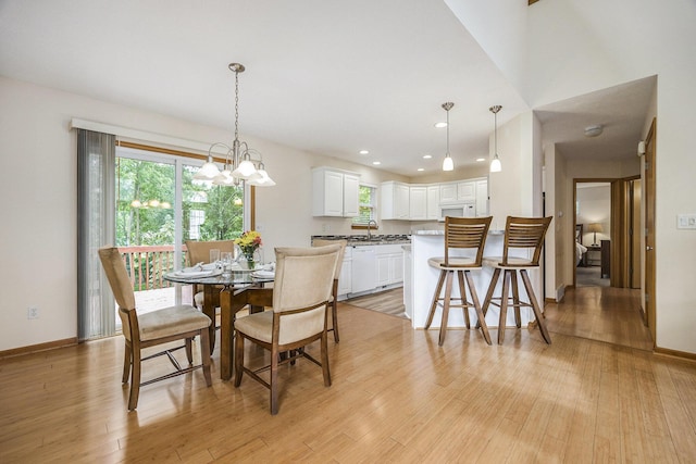 270 Silver Ridge Dr, Holland, MI 49424 - dining room featuring healthy amount of natural light, light wood-type flooring, a chandelier, and recessed lighting