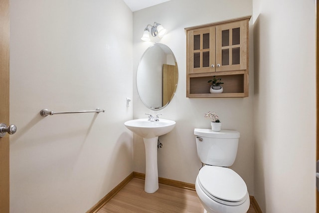 270 Silver Ridge Dr, Holland, MI 49424 - bathroom featuring toilet and wood finished floors