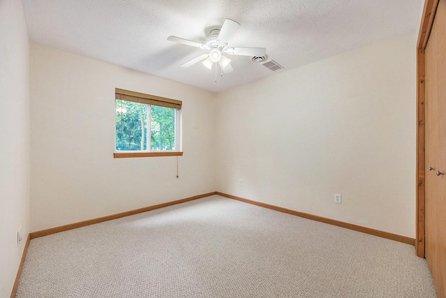 270 Silver Ridge Dr, Holland, MI 49424 - spare room featuring light colored carpet, a ceiling fan, and a textured ceiling