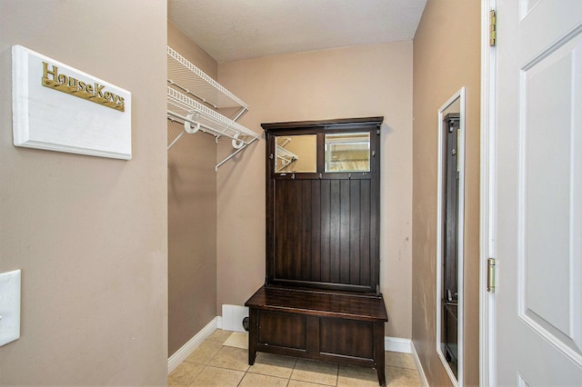 5625 Bay Meadow Trl, Portage, MI 49024 - mudroom with baseboards and light tile patterned floors