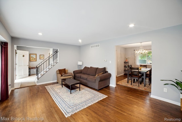 6810 Killarney Dr, Troy, MI 48098 - living room featuring stairway, a chandelier, dark wood-style flooring, and recessed lighting