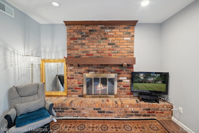 6810 Killarney Dr, Troy, MI 48098 - living room featuring a fireplace, wood finished floors, and recessed lighting