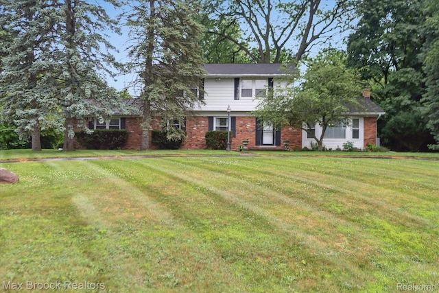 6810 Killarney Dr, Troy, MI 48098 - view of front of house with a front yard and brick siding