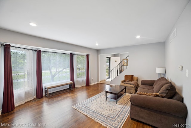 6810 Killarney Dr, Troy, MI 48098 - living area featuring stairs, wood finished floors, and recessed lighting