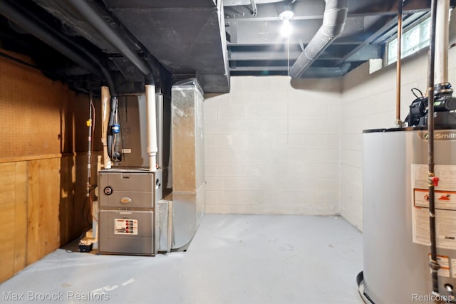 6810 Killarney Dr, Troy, MI 48098 - unfinished below grade area featuring water heater, heating unit, and concrete block wall